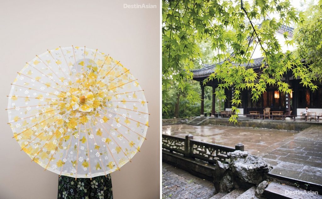 An umbrella maker shows off her work at the Hangzhou Arts & Crafts Museum; a rain-slick courtyard next to the Dragon Well at Longjing village.