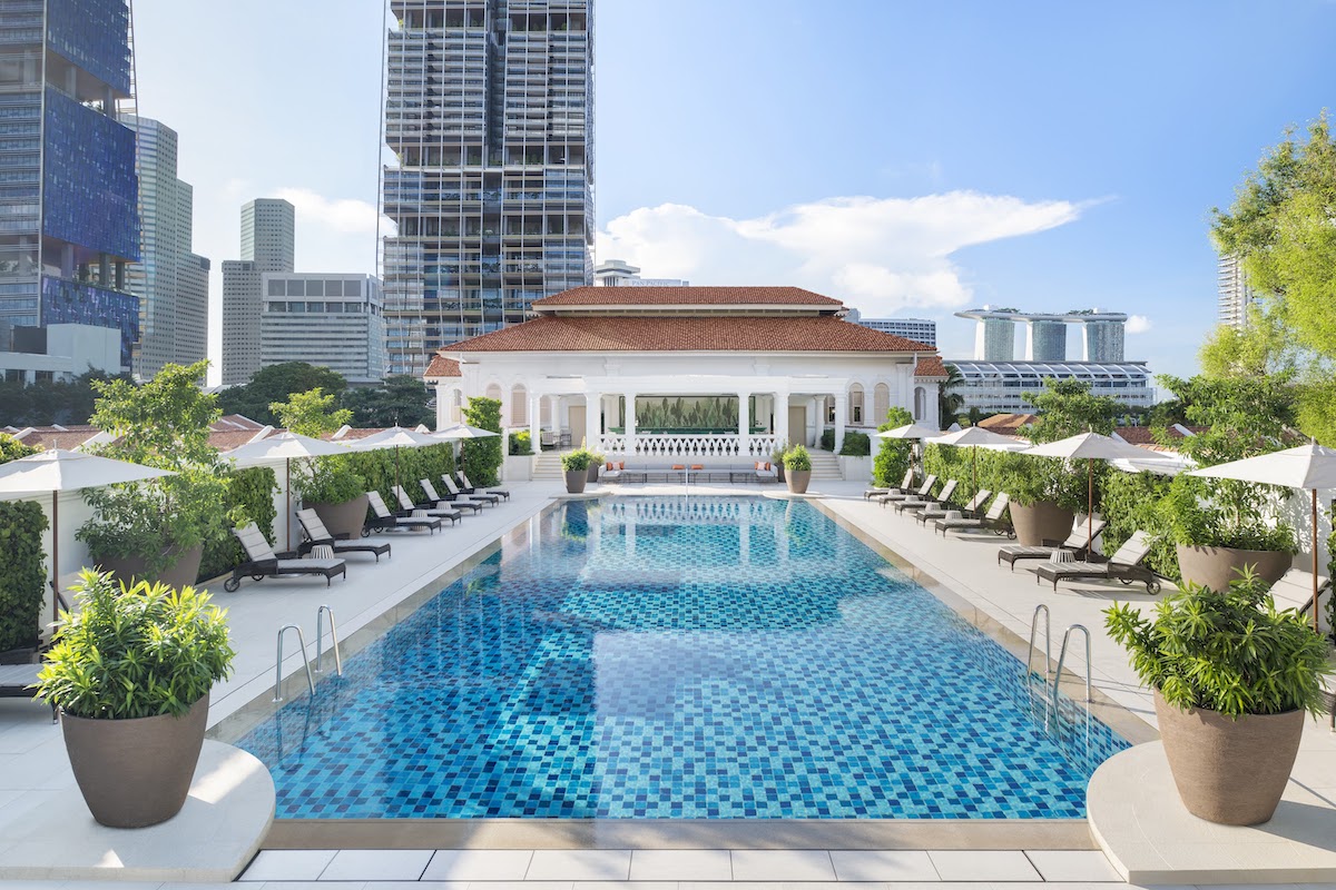 A view of the rooftop swimming pool at Raffles Singapore.